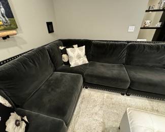 4) $950 - Custom designed L-shaped sectional in dark gray. Six pillows are included. Long section measures 152" x 44", shorter section measures 118" x 44". Back height is 36". Great condition.
