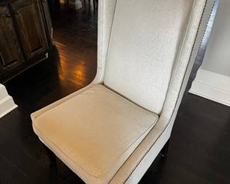 2)  $400 - Set of two custom captain's chairs. Fabric is white/light gray with a silvery sheen. Chairs measure 27" x 25" x 19" x 45". 
