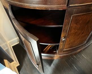 3) $350 - 1/2 round wood buffet by Bassett. One drawer and four cabinets in a dark wood. Buffet measures 67" x 26" x 39".