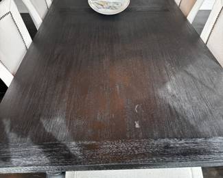 1) $950 - Black dining room table and six dining chairs from Restoration Hardware. Table measures 43" x 108" x 30 and has a couple of nicks. Almond colored linen upholstered dining chairs show wear and stains. Chairs measure 21" x 28" x18" x 40".
