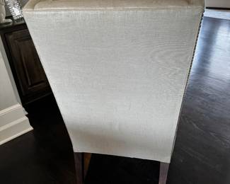 2)  $400 - Set of two custom captain's chairs. Fabric is white/light gray with a silvery sheen. Chairs measure 27" x 25" x 19" x 45". 