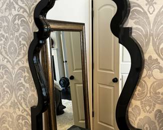 12) $300 - Set of two bedside mirrors. Black lacquered frame measures 26" x 37".