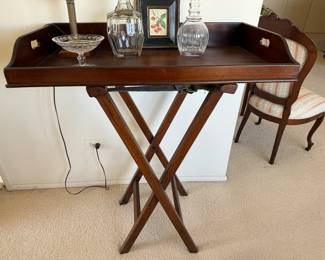 English mahogany tray on stand                                                              (leather belts being used as tray straps)