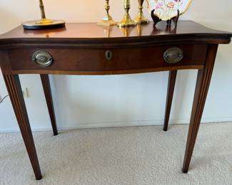 Vintage flip-top mahogany table                                              29"h x 36"w x 18"d 