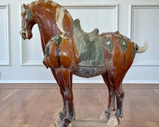 MONUMENTAL DECORATIVE TANG HORSE | probably 20th century, with green glazed saddle and brown body