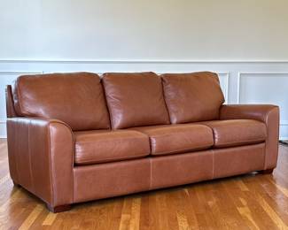 AMERICAN LEATHER FOR BLOOMINGDALES PECAN SOFA | An exceptional American made three cushion sofa in rich pecan brown leather with decorative stiching
