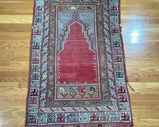 ANTIQUE PRAYER RUG | With geometric patterned border and a red field
