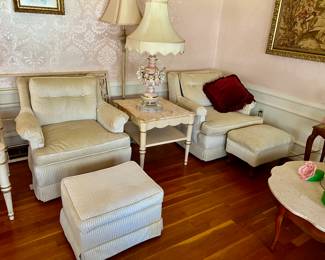 Cream chairs with ottomans