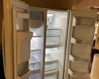 Side-by-side refrigerator with ice maker and front door water dispenser