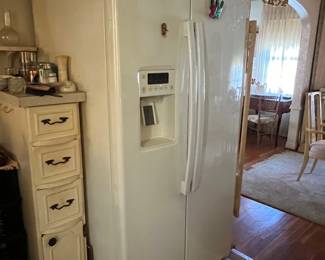 Side-by-side refrigerator with ice maker and front door water dispenser