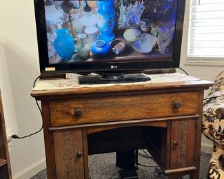 antique desk and smart tv