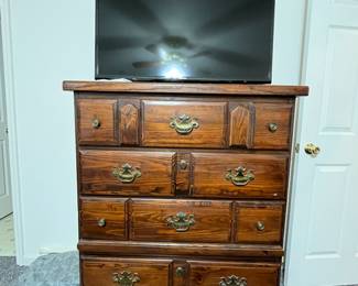 chest of drawers and small smart tv