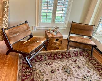 Pair of cowhide “chillin chairs” by Go Home Ltd. (Third available) currently featured in Travis David