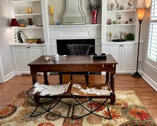 Hand carved desk with two cowhide seats, mirror and decor