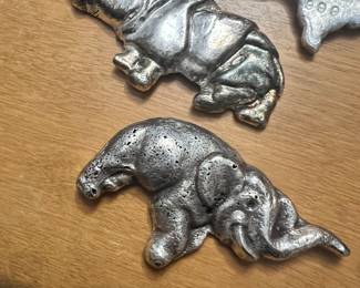 Silver hand poured elephant & Rhino