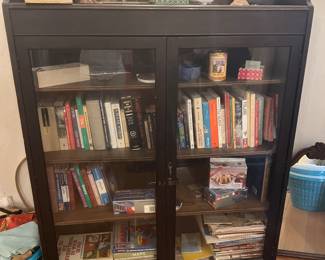 Glass doored bookcase and books