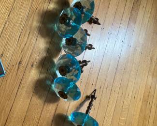 Six antique teal glass drapery stays