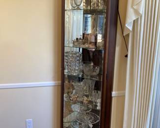 Howard Miller lighted corner curio cabinet