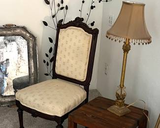 Vintage dining chair, unusual square table on round disc (allowing the table to spin)… oak, handmade. Metal leaf wall art, table lamp