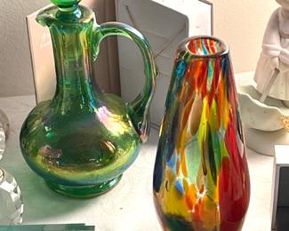 Green iridescent bottle with stopper and colorful glass bud vase