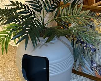 Kitty litter artificial plant! Just turn it around and no one knows it’s for your cat!