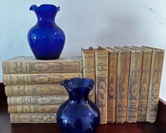 Antique books and cobalt blue vases
