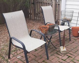 Two used and comfortable lawn chairs. And a cute small, foldable table.