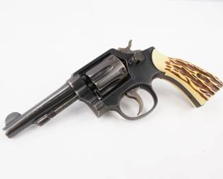 Make: Smith & Wesson
Model: 10
Caliber: 38 S&W Special CTG
Action: DA
Barrel: 4
Bore: Shiny
Serial # 240847
Condition: Very Good
The Smith & Wesson Model 10, previously known as the Smith & Wesson .38 Hand Ejector Model of 1899, the Smith & Wesson Military & Police or the Smith & Wesson Victory Model, is a K-frame revolver of worldwide popularity. In production since 1899, the Model 10 is a six-shot, .38 Special, double-action revolver with fixed sights. This Model is the 10-6 is the heavy barrel model 10 Featuring a 4 inch barrel with bright bore. This revolver is in very good condition showing normal signs of use and wear. 