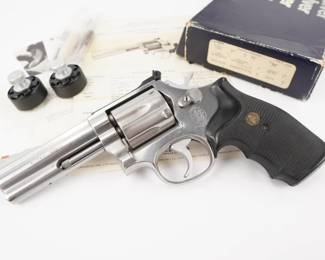 Make: Smith & Wesson
Model: 686
Caliber: .357 Magnum
Action: DA
Barrel: 4
Bore: Shiny
Serial # AHD0634
Condition: Excellent
Smith & Wesson model 686, a 4 inch 357 magnum 6 shot revolver, built on the L frame. It is a stainless steel double action single action revolver. It has use and handling marks, but has its original blue cardboard box. Includes a speed loader. The rifling is sharp and shiny. The action is tight. 