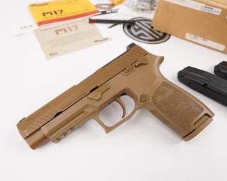 Make: Sig Sauer
Model: M17
Caliber: 9mmx19
Action: Semi
Barrel: 5
Bore: Shiny
Serial # TF003470
Condition: Excellent
Sig M17 surplus pistol. This pistol was used by the US Army to test out the new Sig M17 pistol. The safety, the slide stop and the take down lever and all finish in a coyote tan. This was changed on the final pistol adapted by the US Army. This is a rare piece of history. Comes with one 17 round magazine and 2 21 round magazines. There is also an extra recoil spring for use with different ammunition. It is a 4.7 “ barrel that has strong rifling. This pistol is used as it was issued. It has a frame mounted safety. This would be a perfect candidate to do a freedom of information act on this pistol and figure out where and when it deployed. Comes with the original box from Sig.