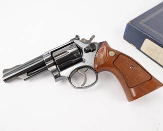 Make: Smith & Wesson
Model: 53-2
Caliber: .22 Magnum
Action: DA
Barrel: 4.55
Bore: Shiny
Serial # 4K48725
Condition: Excellent
Smith & Wesson model 53-2, a rare gem of a revolver. In 22 remington jet. Has all six inserts to allow you to fire 22 long rifle in it, with a unique hammer design to allow you to shoot rimfire or centerfire cartridges in the same gun. It is a 6 shot double action revolver, with a four inch barrel, and comes with the original blue cardboard box. Such a good gun even the king Elvis Presly owned a Smith & Wesson model 53. The action is tight. The rifling is shinny and sharp. 