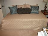 Twin Bed & Decorative Pillows.