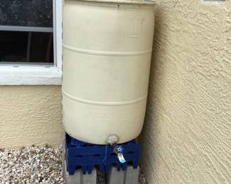 2 rain barrels with downspout connectors