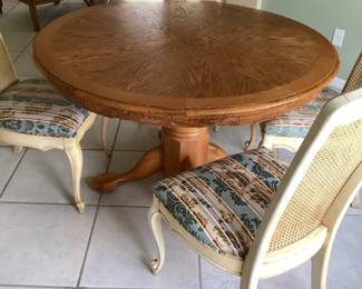 48” round oak table & 4 newly covered chairs.