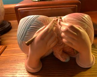Antique planter knitting hands