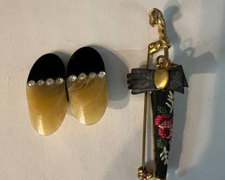 Walking in the rain. Umbrella pin and the shoes pin