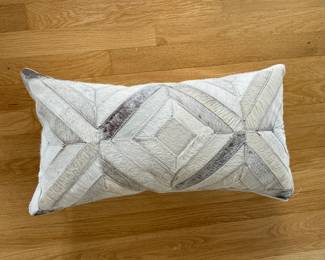 Lattice Cowhide Lumbar Pillow. Measures 20" x 10". Photo 1 of 2.
