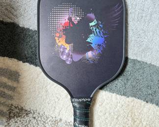 Niupipo Pickleball Paddle and 10 Pickleballs. Photo 1 of 2.
