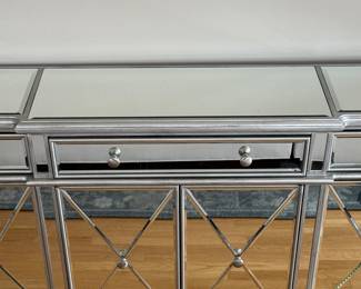 Mirrored Glass Sideboard With Silver Frame and Grey Interior. Includes 3 Drawers and 2 Cabinets With Shelves. Measures 60" W x 14" D x 36" H. Photo 2 of 4.
