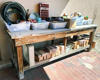 Wood workbench, gardening supplies