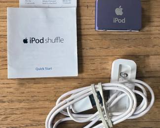 Apple products including chargers, iPod Shuffle, USB Super Drive, iPad Air
