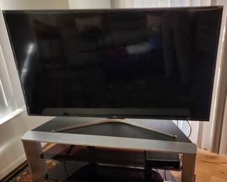 Samsung 65" Smart television 
Contemporary Sony t.v. stand with 2 glass shelves 