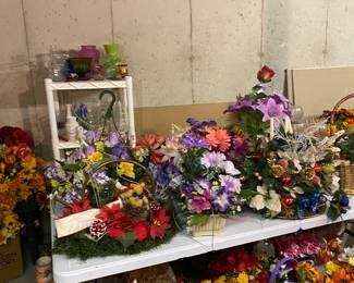 Lots of pretty flower arrangements and loose silk flowers, vases, etc