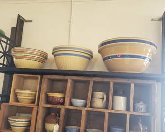 collection of pottery bowls large and small