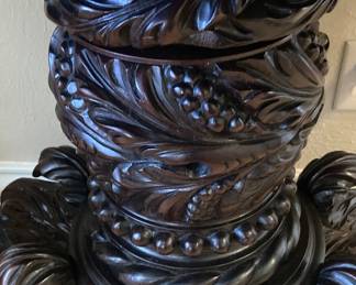 Intricately carved base