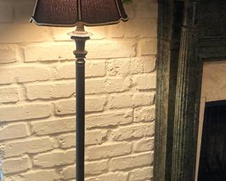 One of two matching floor lamps with black shade.