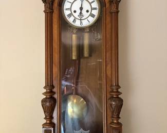A beautiful wall hung double weight clock, running