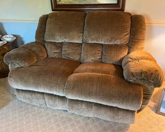 Double reclining upholstered loveseat....