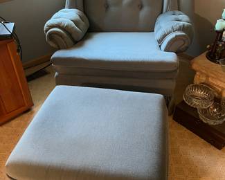 Upholstered armchair with matching ottoman