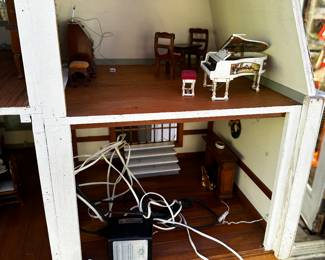 A very large 3 story doll house complete with furniture! 